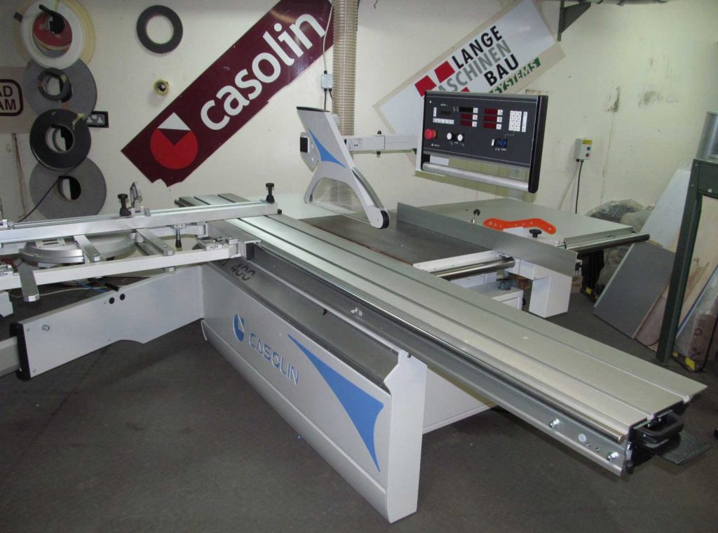 Casolin Astra 400 sliding panel saw with digital control panel displayed in a workshop showroom