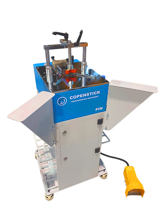 Copenstick PIN woodworking machinery unit with blue housing, clamp assembly, side trays, and yellow foot pedal control
