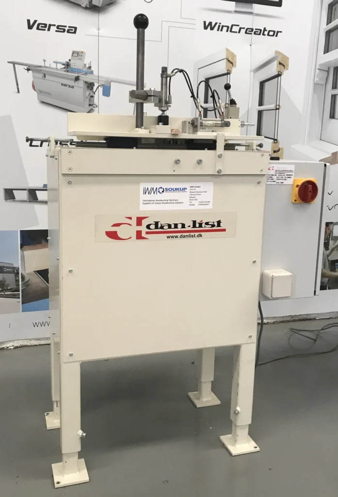 Dan-List PME 100 Endscribe Machine on a workshop floor with IWM Soukup label and machinery display backdrop
