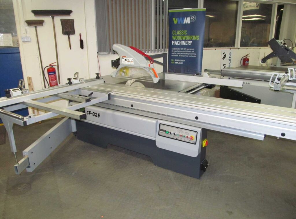 Dominion CP32-E panel saw with sliding table and scoring blade unit displayed in a VWM woodworking machinery showroom
