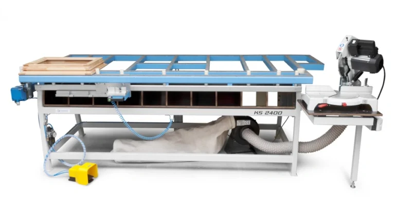 Soukup Assembling Table KS 2400 with blue grid surface, dust extraction bag, mitre saw attachment, and yellow foot pedal
