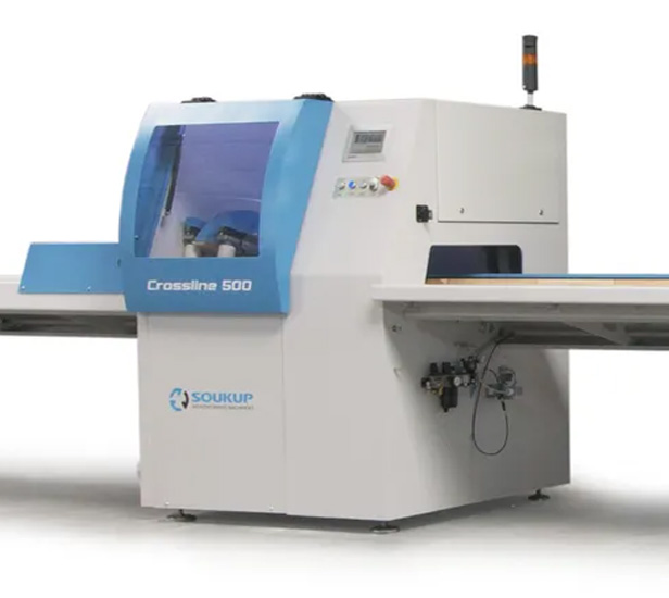 Soukup Crossline 500 cross cut saw machine with blue and white casing and extended feed table
