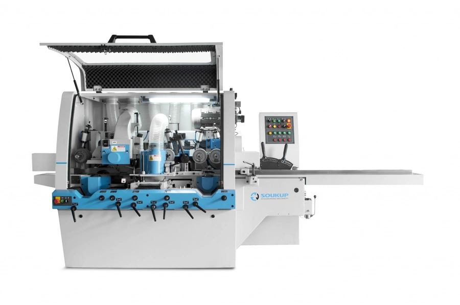 Soukup fourside planer and moulder machine with open guard, blue spindle units, dust extraction hoses and side control panel