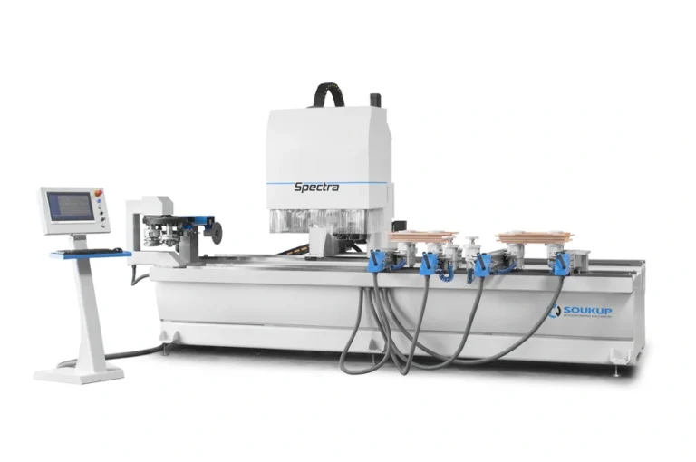 Soukup Spectra CNC working centre with control panel, blue clamps, and vacuum workholding on a white machine bed