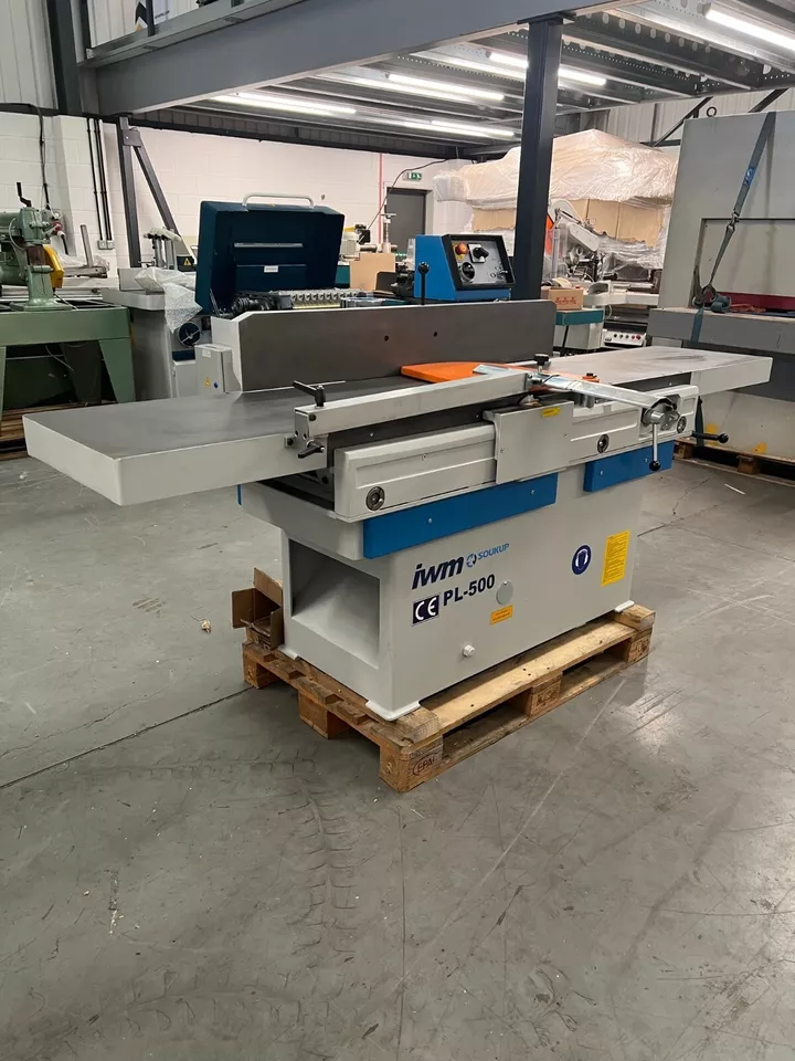 IWM Soukup PL-500 heavy duty surface planer 500mm wide, mounted on a wooden pallet in a workshop